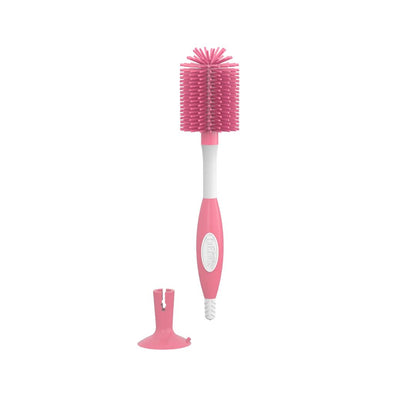 Dr Brown's  Pink bottle brush with a white handle on a white background