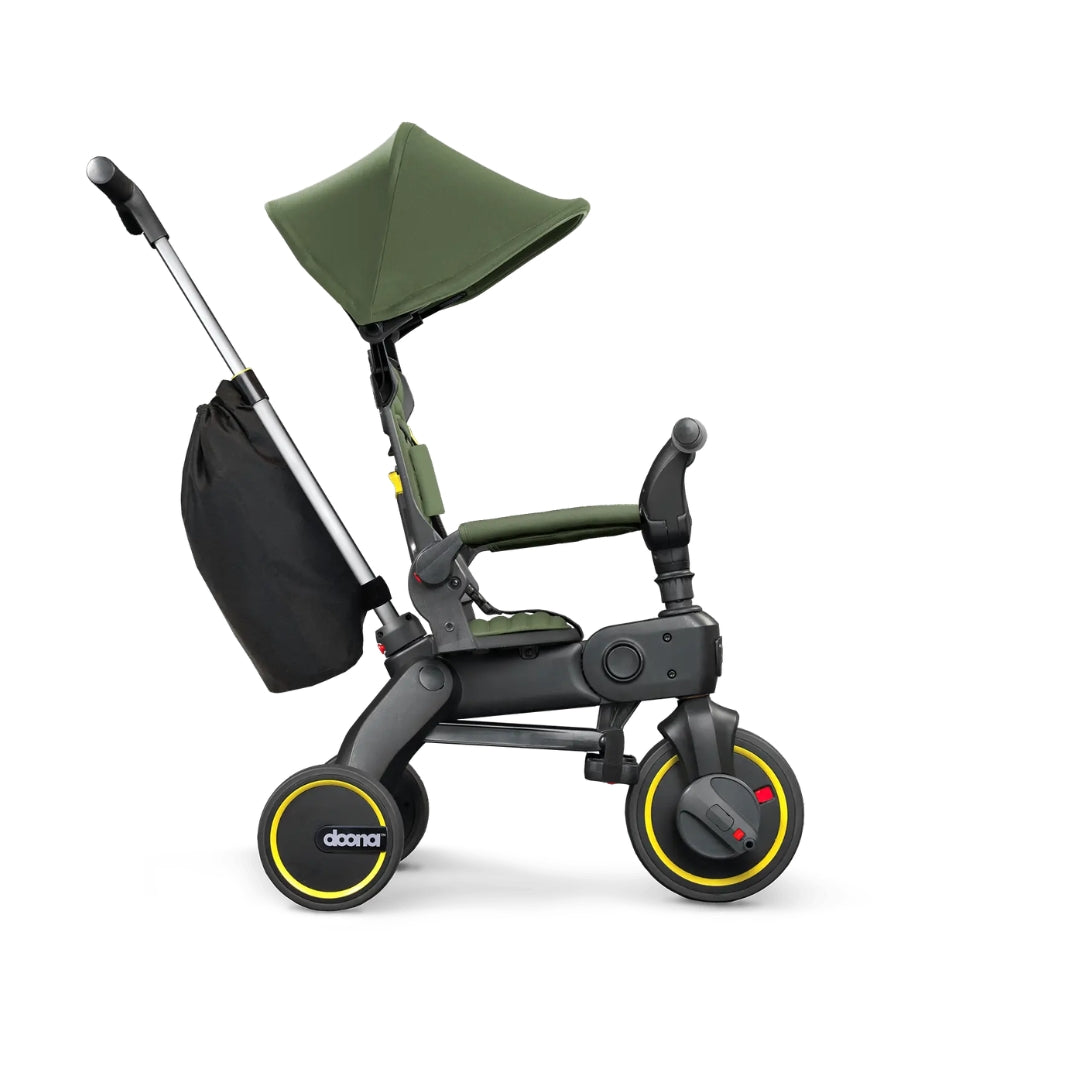 Doona Green and black children's tricycle with canopy on a white background
