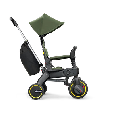 Doona Green and black children's tricycle with canopy on a white background