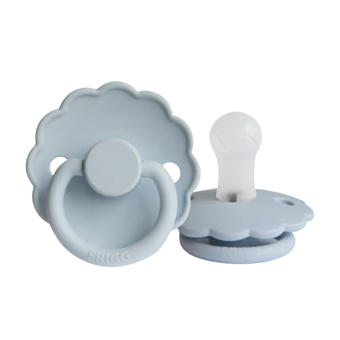 Frigg light blue baby pacifiers on a white background