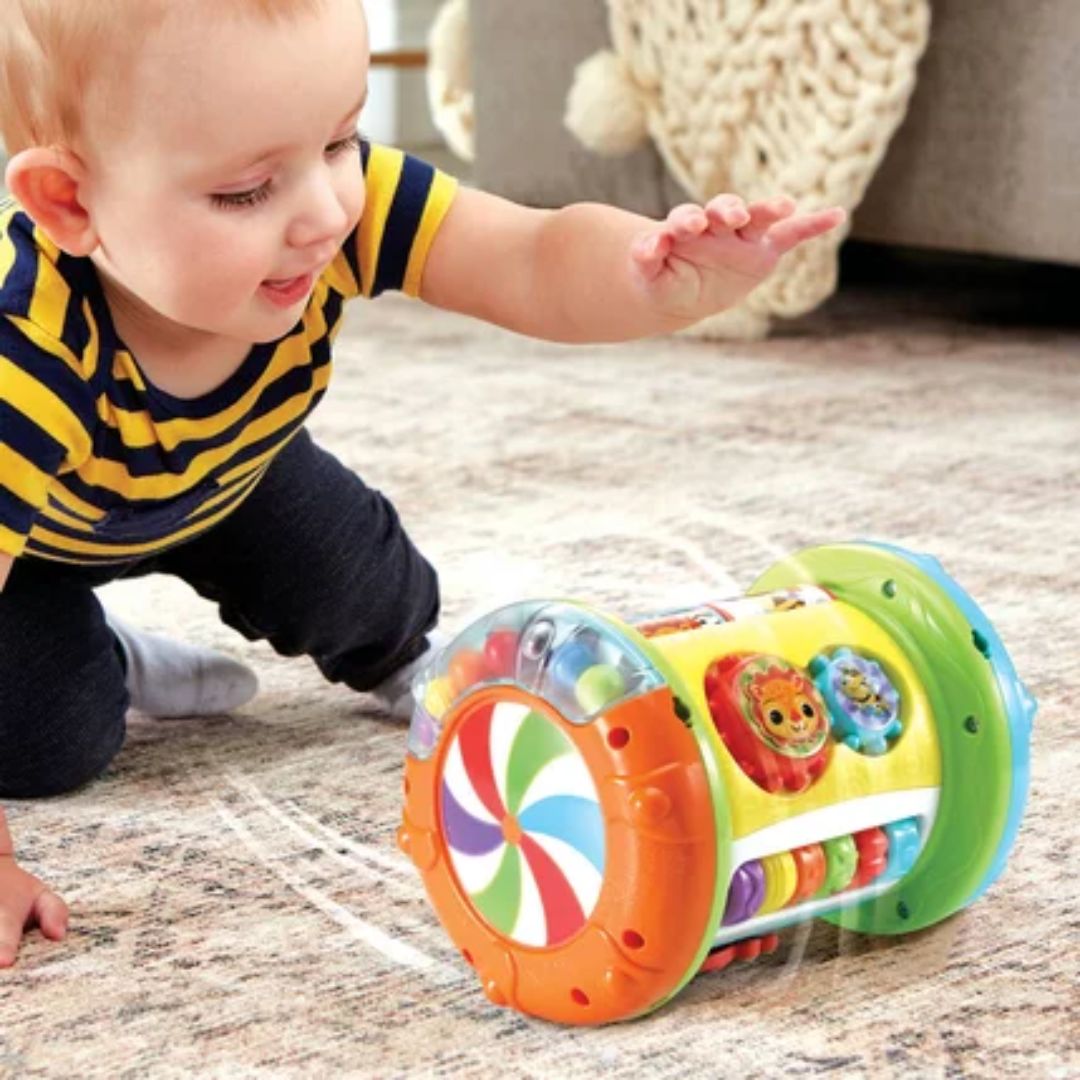 Child playing with a colorful toy on a carpeted floor