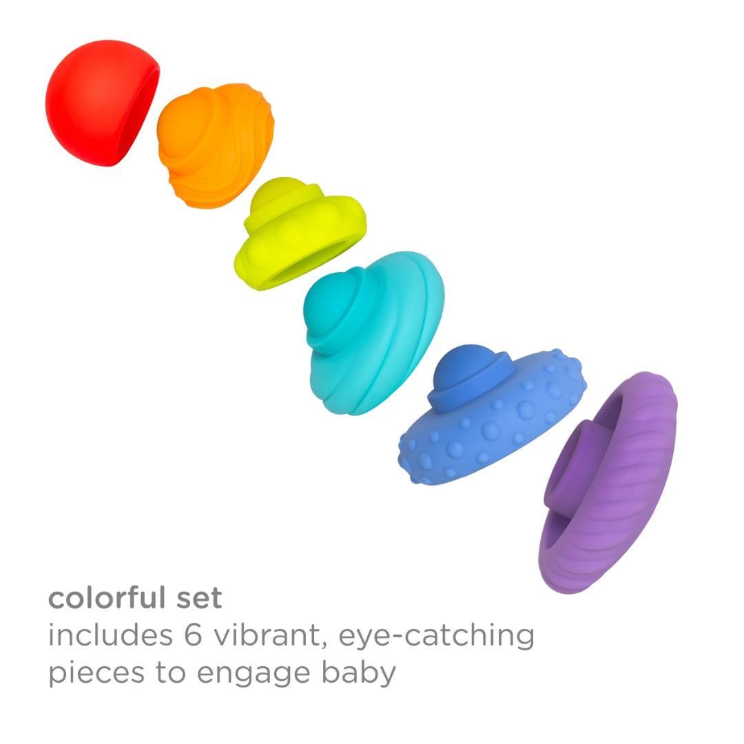 Set of colorful ubbi baby teething toys on a white background