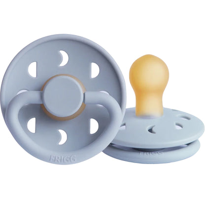 Frigg baby pacifiers with light blue designs on a white background