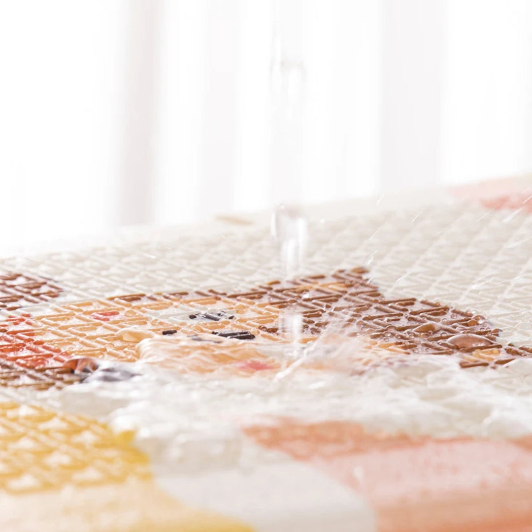 Miila double sided playmat, waterproof playmat, on a white background.