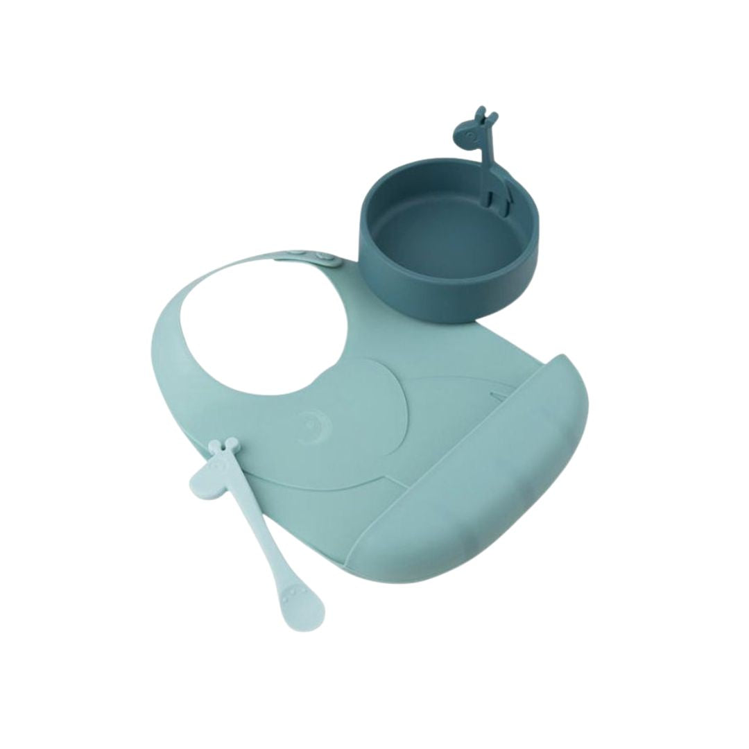 Teal silicone bib with attached cup and spoon on a white background