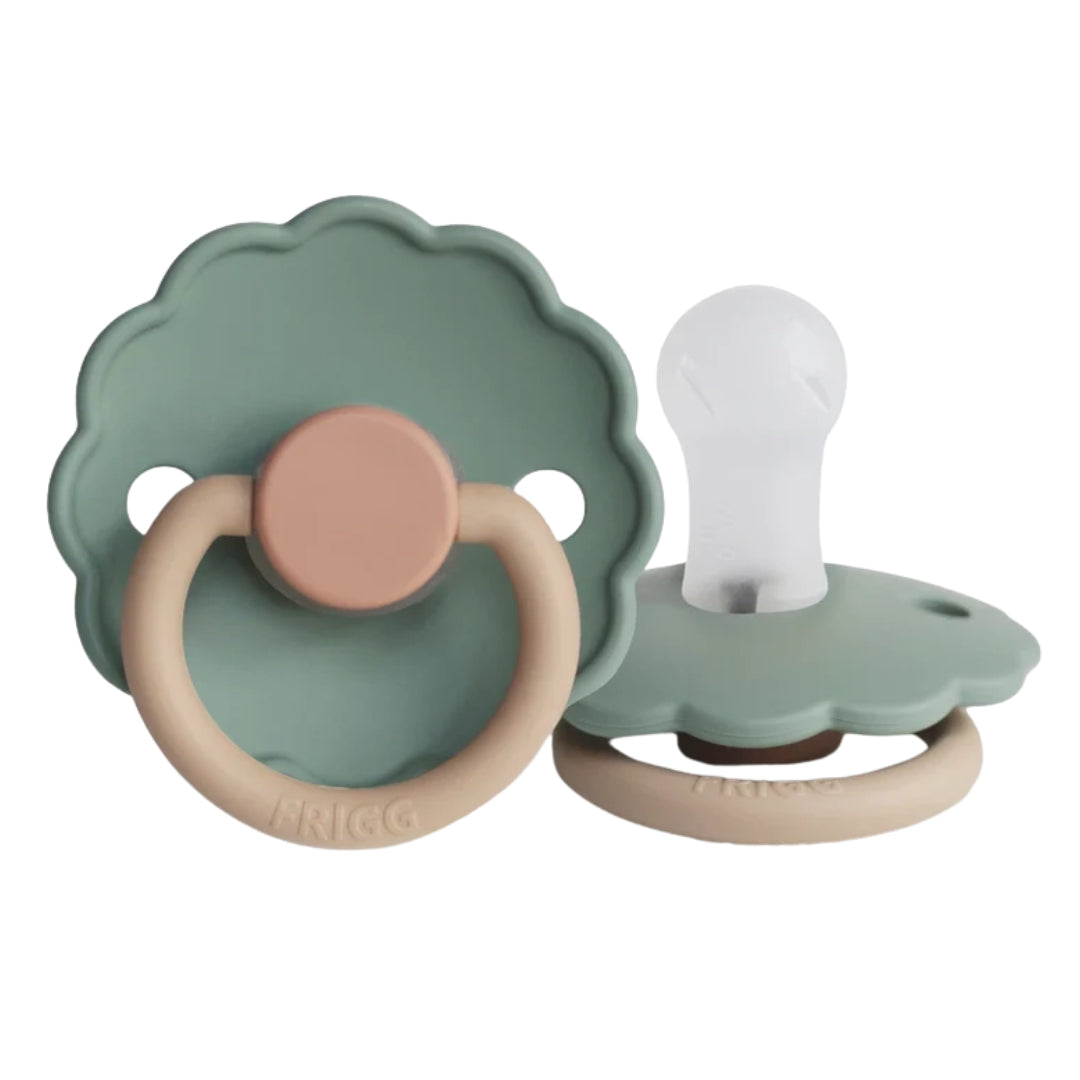 Army Green Frigg baby pacifiers with different colored rings on a white background