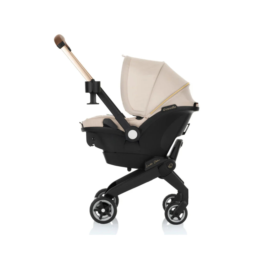 Evenflo Black stroller with beige seat on a white background