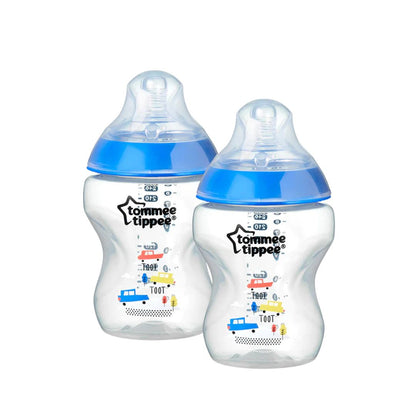 Two Tommee Tippee baby bottles with blue lids on a white background