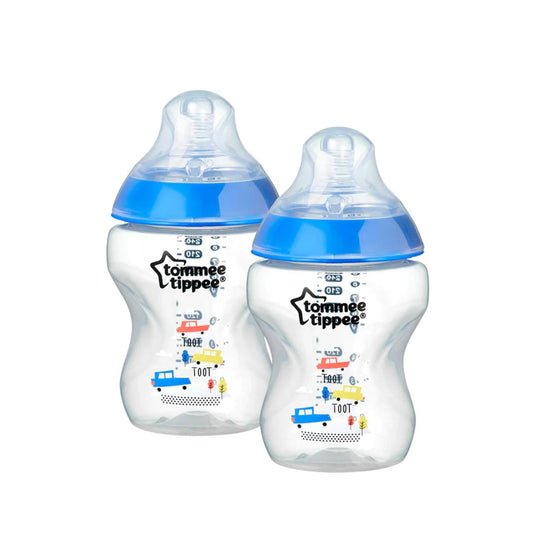 Two Tommee Tippee baby bottles with blue lids on a white background