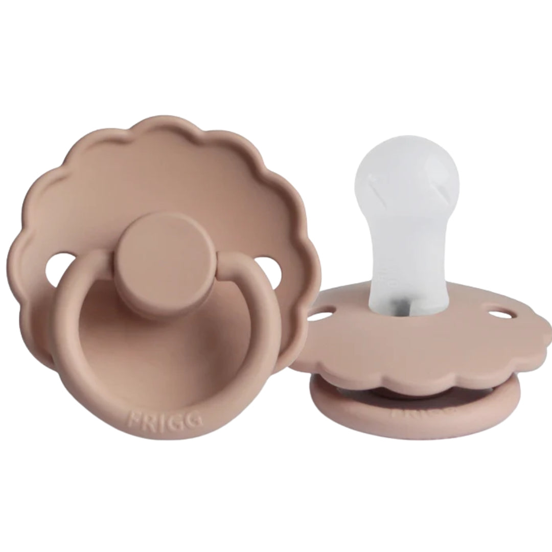Frigg silicone baby pacifiers in a Pinky beige color on a white background