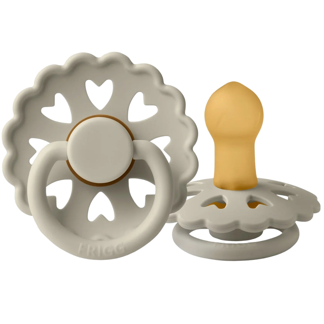 Frigg baby teething rings with decorative patterns on a white background