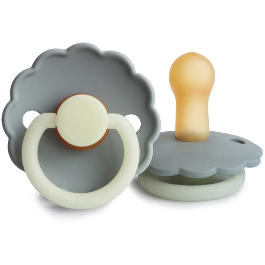 Frigg baby pacifier with different designs on a white background