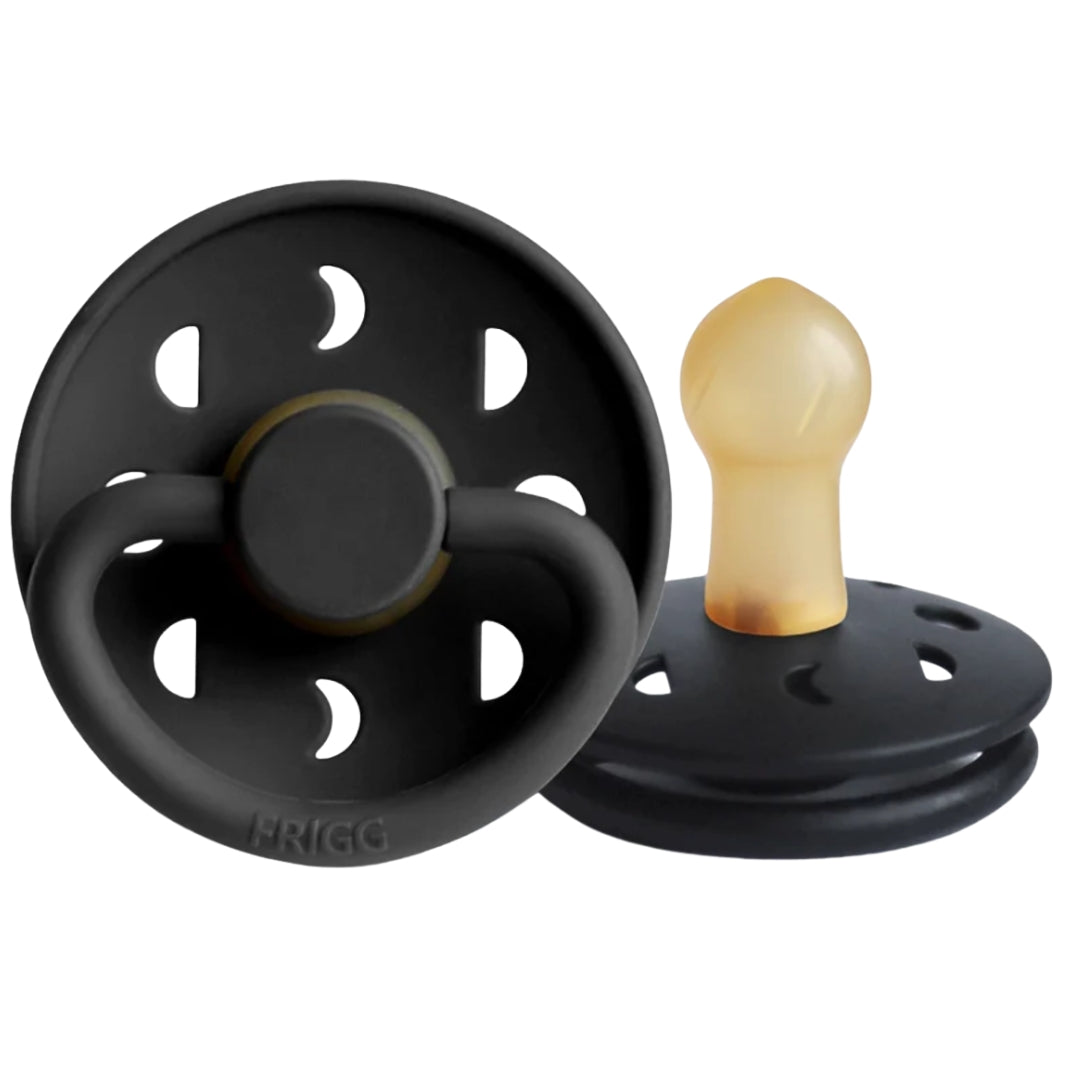 Frigg black baby pacifiers on a white background
