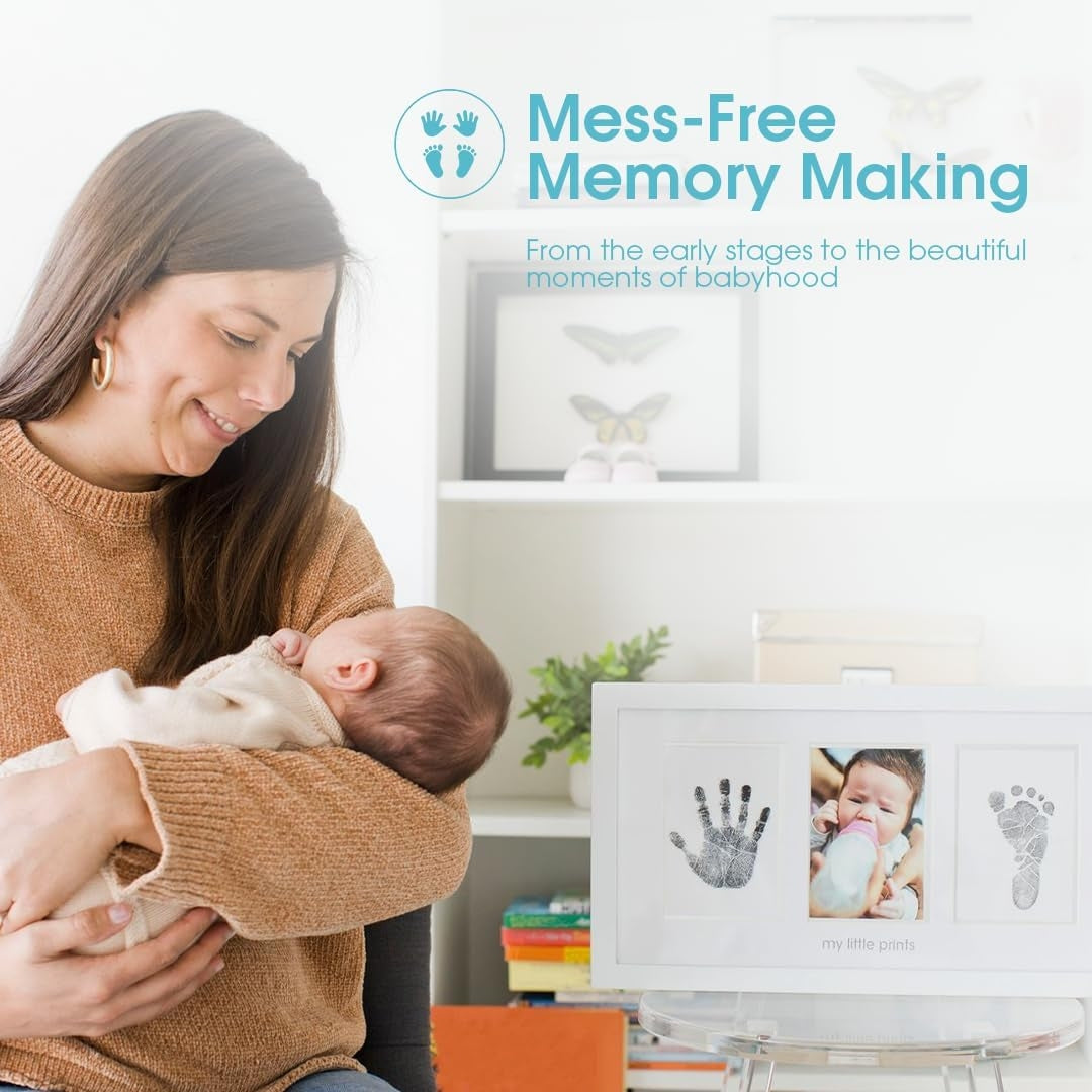 Woman holding a baby with a Pearhead framed handprint and photo of the baby in the background, labeled 'Mess-Free Memory Making'.