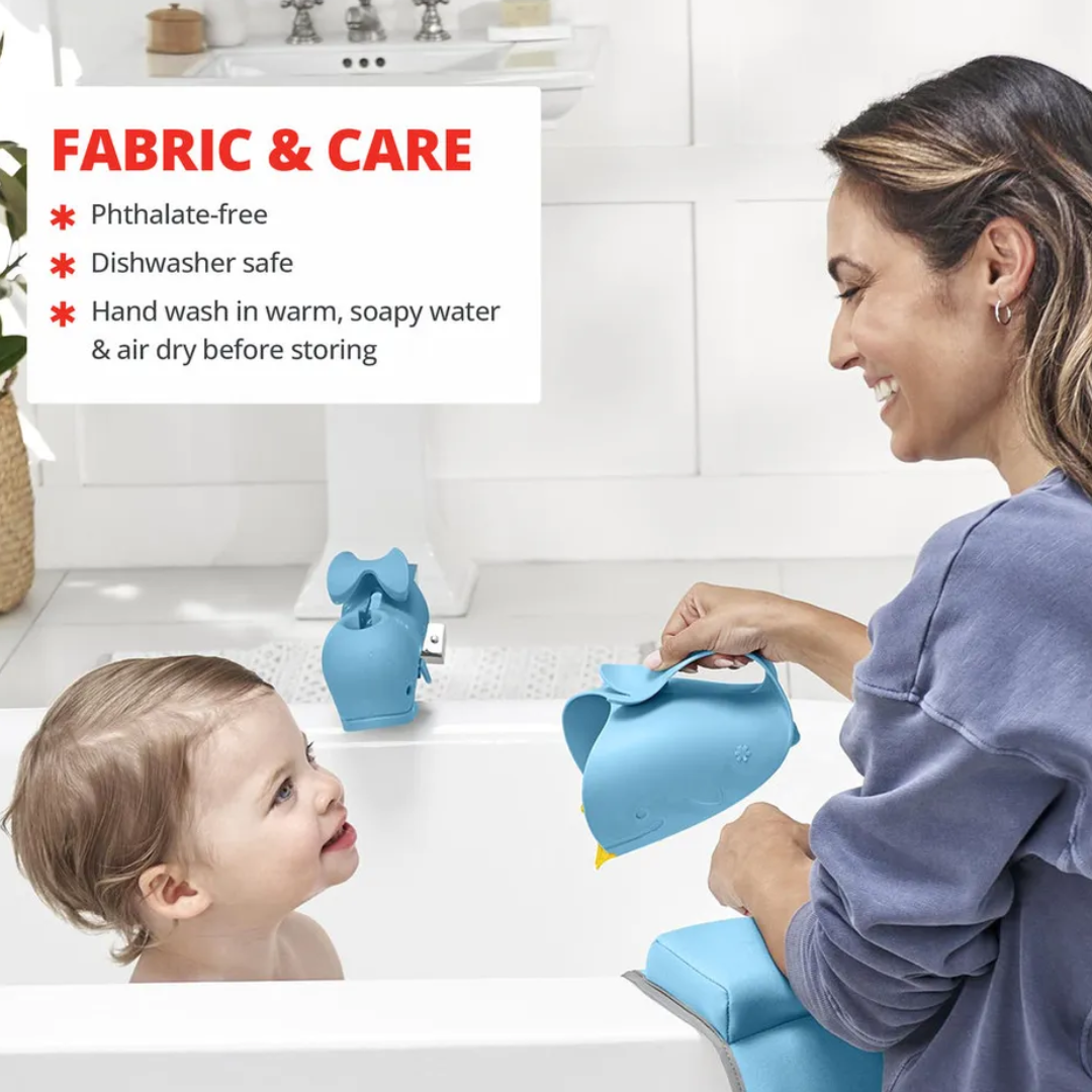 A smiling mother filling the Skip hop whale-shaped bath rinser with water while a toddler sits in the bathtub nearby, with text listing care instructions: phthalate-free, dishwasher safe, hand wash in warm soapy water and air dry.