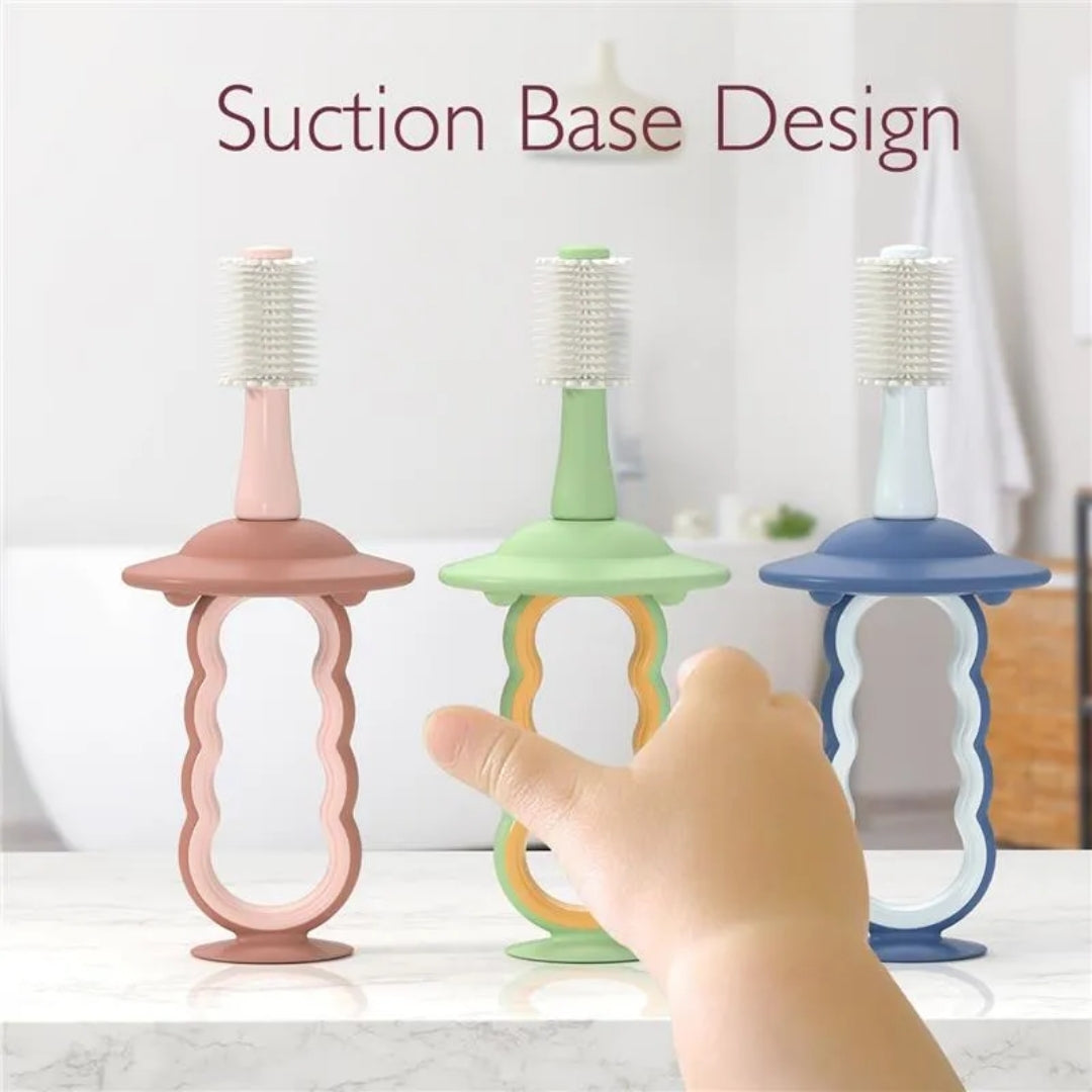 Three colorful momcozy toothbrush holders with a hand pointing to one of them, labeled 'Suction Base Design'.