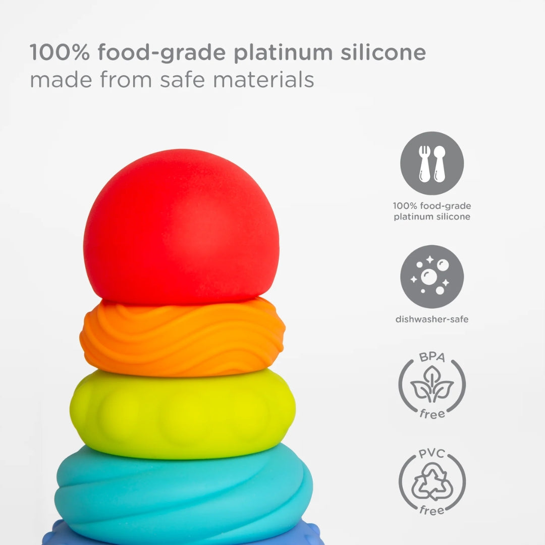 Stack of colorful silicone rings with safety certification icons on a white background