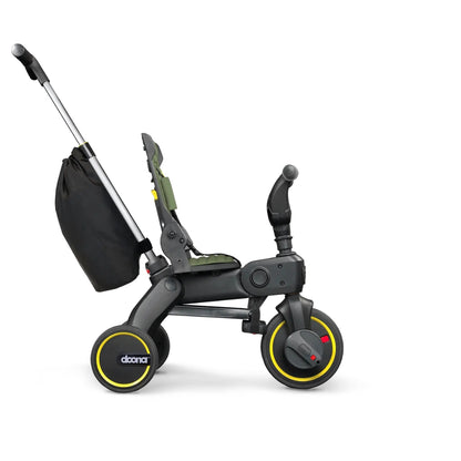 Doona Child's tricycle with black seat and yellow wheels on a white background