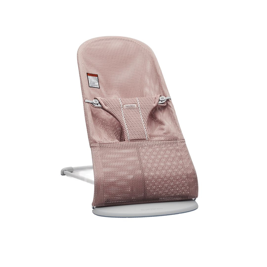 Baby Jorn baby bouncer with pink mesh seat and white base on a white background