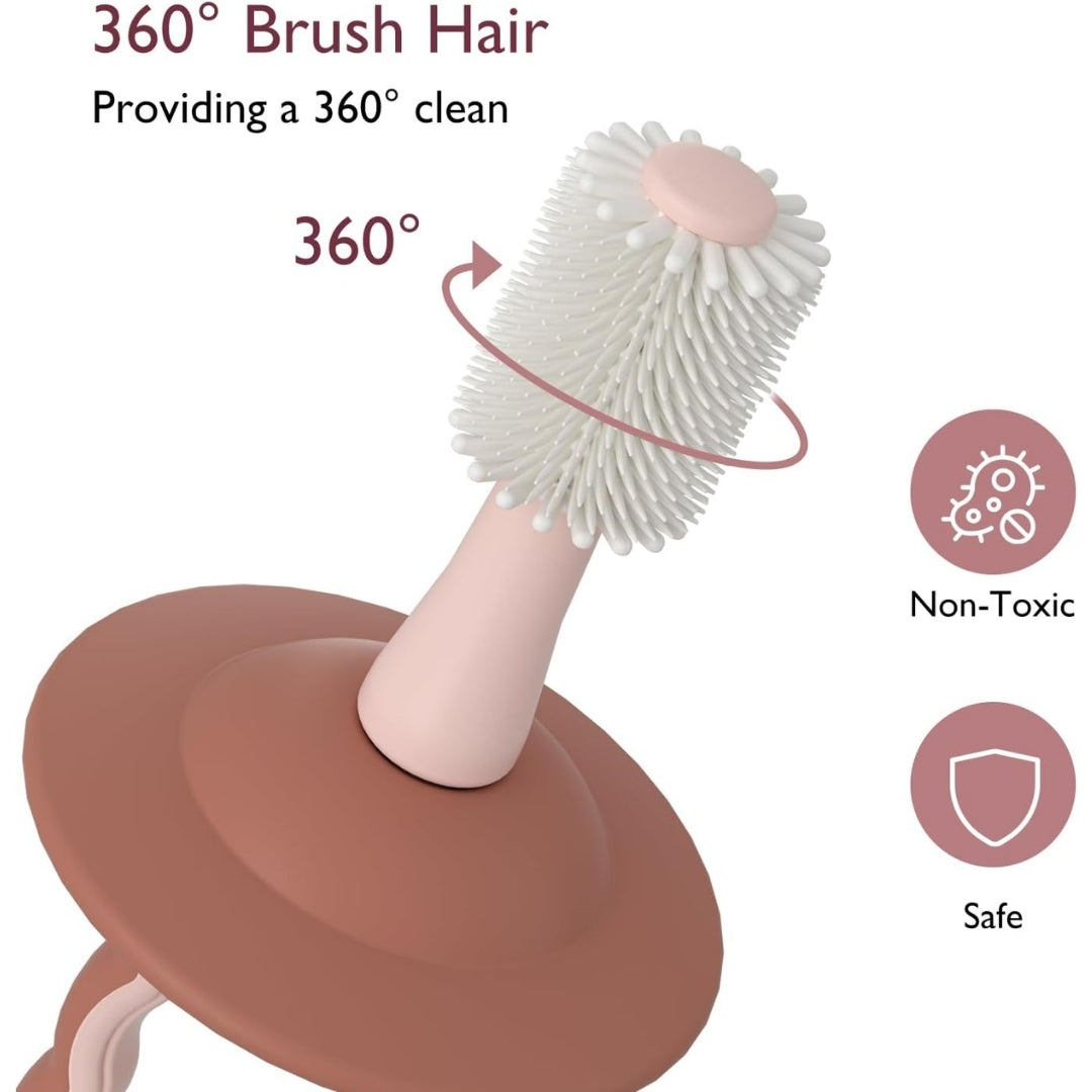 Momcozy toothbrush with 360-degree and pink handle on a white background