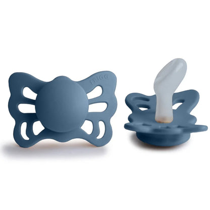 Frigg blue butterfly-shaped pacifiers on a white background