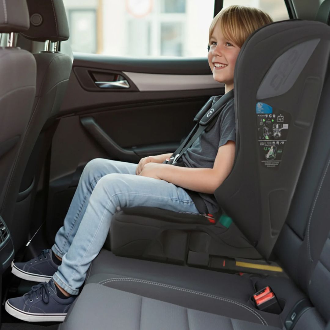 Child sitting in an Asalvo car seat inside a vehicle