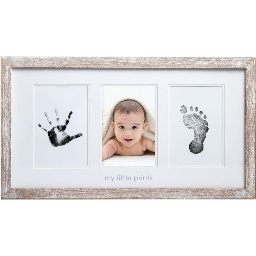 Baby photo and Pearhead handprint/footprint frame with 'my little prints' text on a white background