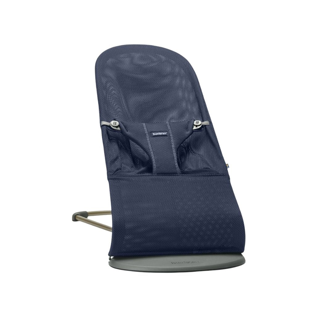 Navy blue baby jorn baby bouncer with mesh design on a white background
