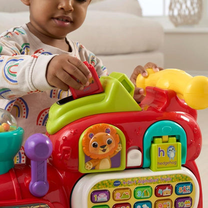 Child playing with a colorful Vtech toy train featuring animal characters.