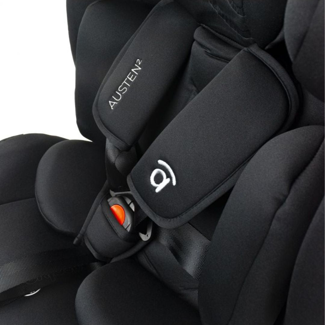 Asalvo Austen Close-up of a black car seat with 'Austen' branding and safety harness.