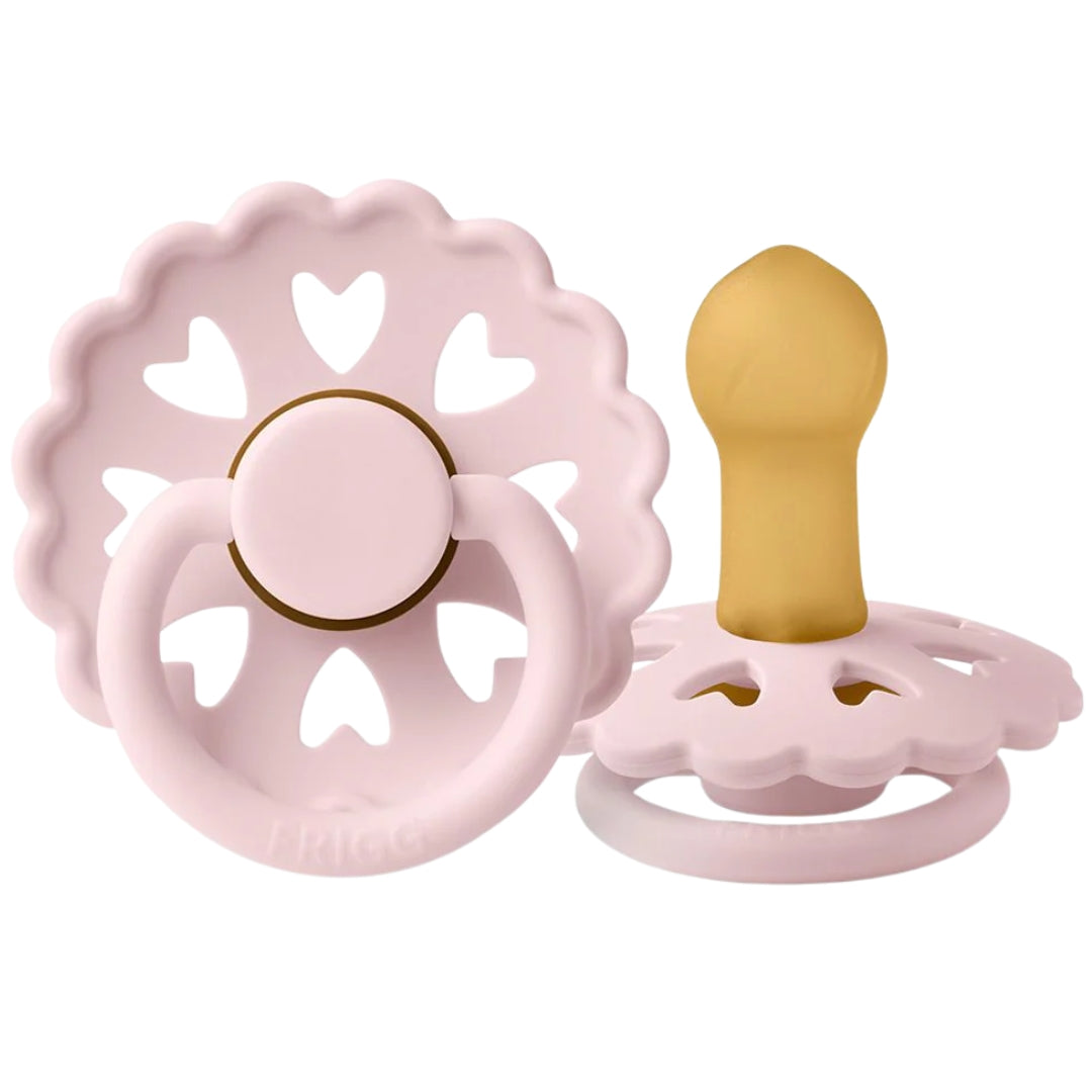 |Frigg Pink pacifier with heart designs on a white background