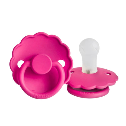 Fuchia pink baby pacifiers on a white background